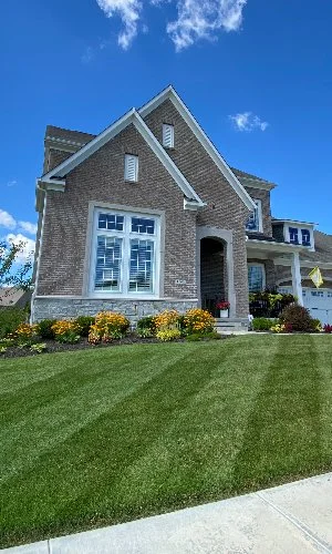 Mowed front lawn with stripes in Carmel, IN.
