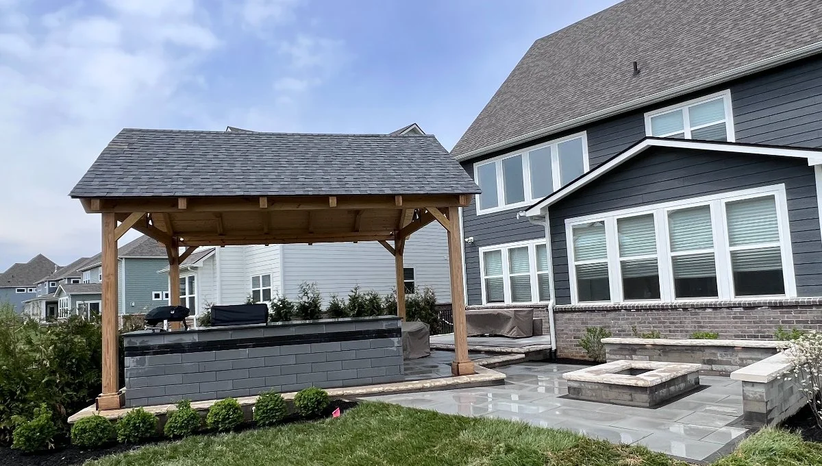 Outdoor living space with patio, fire pit, outdoor kitchen, and more in Carmel, IN.